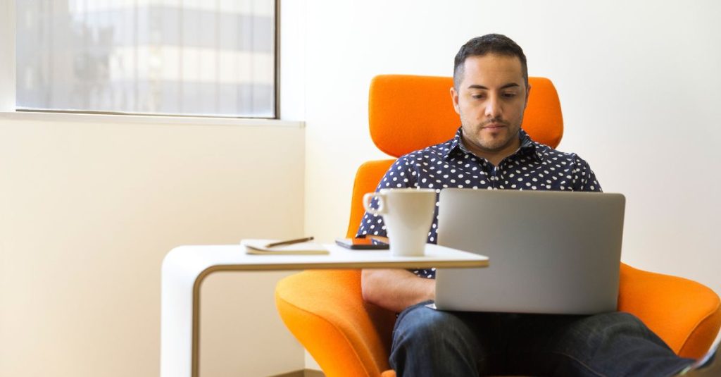 A manager documenting on his computer