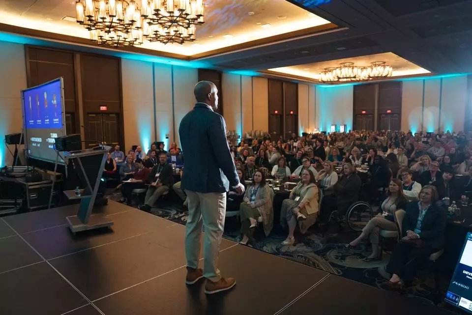 A full room for a keynote at the 2026 Summit