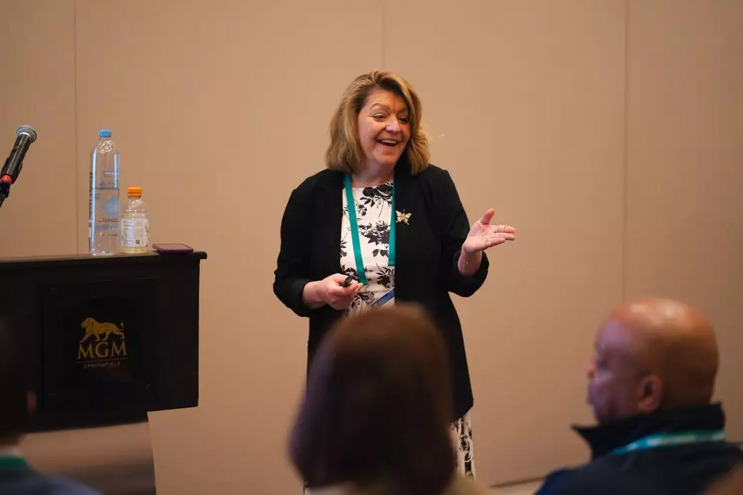 A workshop presenter talks with attendees in a breakout room